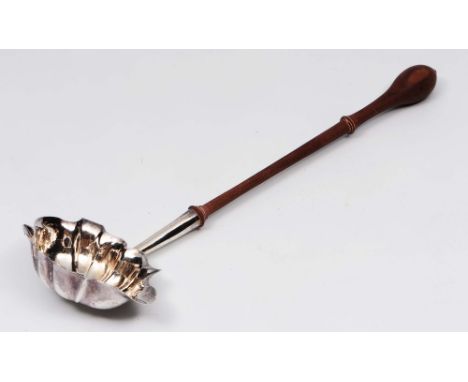 A Georgian silver toddy ladle of shaped form with later turned wood handle, marks indistinguishable