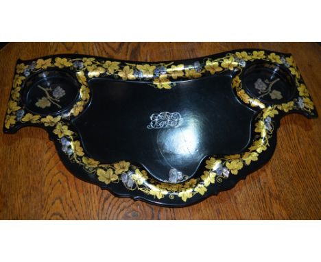 A Jennens & Bettridge papier mache large tray/coaster of black ground with mother of pearl vine and gilt leaf designs, 73cm a