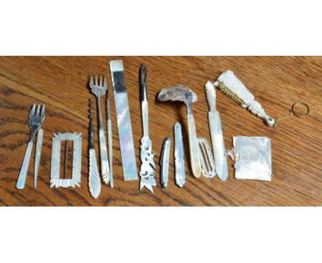 A small collection of miscellaneous mother-of-pearl items including a penknife, a ruler, a buckle, a fan, ink pens etc