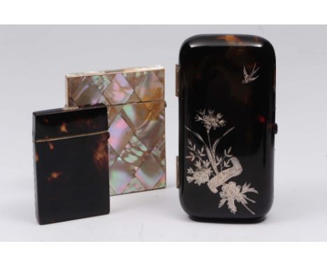 A tortoiseshell spectacles case of rectangular form with inlaid white metal decoration showing flowers and a swallow, togethe