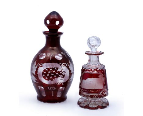 A Bohemian ruby glass decanter 19th century  engraved with rural scenes, height 21 cm, together with a glass sent bottle, rub