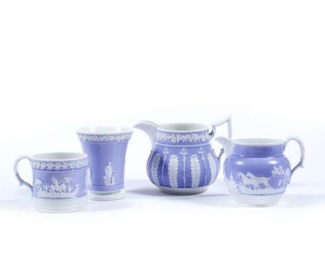 A collection of Newhall bone china circa 1820 to include a large jug, a smaller hunting jug, a tankard and a spill vase (poss