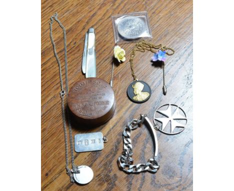 A small collection of miscellaneous including a silver identity bracelet, a silver ingot, a St Christopher, a silver pendant 