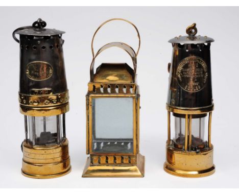 Two miners lamps marked Patterson Lamp Ltd, Gateshead and the Protector Lamp Eccles, and one other brass hand lantern (3)