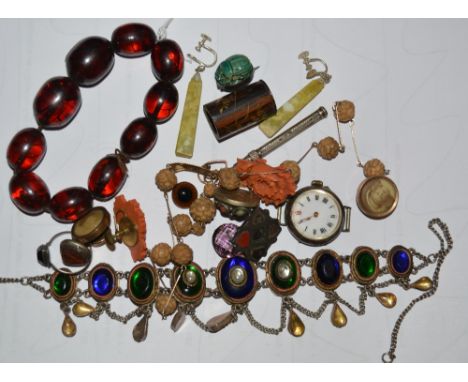 A small collection of miscellaneous jewellery including a pair of carved coral earrings, a ceramic scarab beetle brooch, a Vi