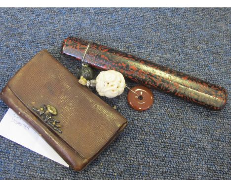 Japanese male purse with netsuke additions and a medallion contained in the purse GVF