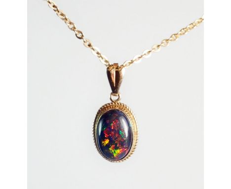 A gold mounted cabochon cut black opal pendant on 9ct gold chain 41cm long 3.2g (pendant not marked) total weight 4.8g, penda