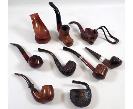 Eight various pipes including bulls head and shoe novelty examples and two pipe stands 