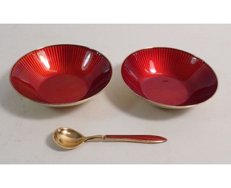 A pair of Norwegian David Andersen silver gilt and red enamel circular salts and one spoon 