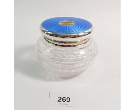 A cut glass dressing table bowl with silver and blue enamel lid, 10cm diameter, London 1929 