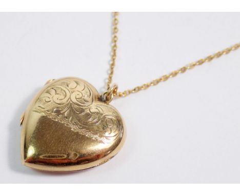A heart form 9ct gold front and back locket, 2.4cm on 9ct gold chain, total weight 5.7g 