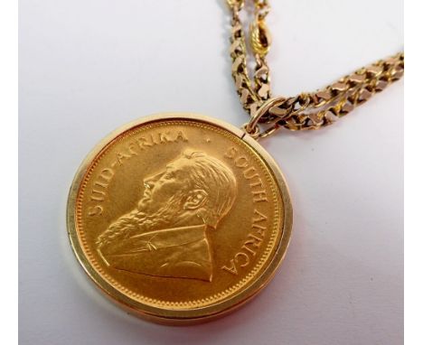 A gold Krugerrand 1974, 1oz 22ct gold plus a 9ct fancy link gold chain, 9ct gold mount, total weight 64g