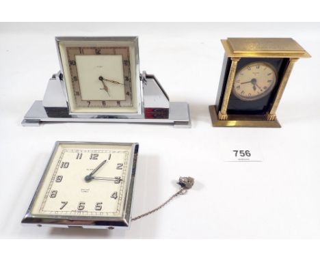 A Swiza eight day gilt metal alarm clock plus two Smiths examples (3) 