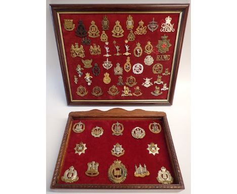 A framed display of forty eight military cap badges including Military Police, Army Ordanance etc. and a glazed display of th