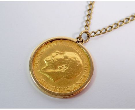 A George V 1912 gold sovereign on 9ct gold mount and chain, total weight 16.4g, 66cm long 