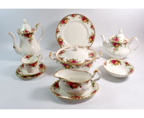 A Royal Albert dinner and tea service comprising six dinner plates, six tea plates, six side plates, six bowls, two meat plat
