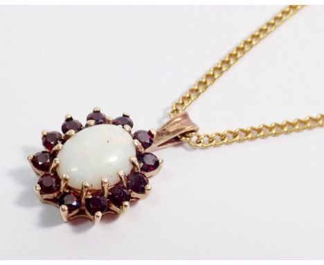 A gold oval opal and garnet pendant on gold plated chain, pendant unmarked but tested as 9 carat gold 