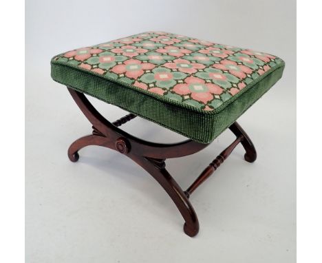 A Victorian rosewood stool with tapestry top on curved X-frame supports 