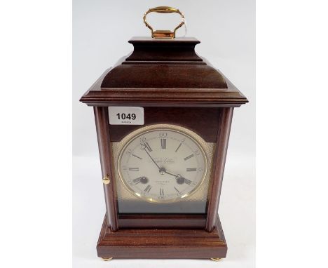 A Knight Gibbins mahogany cased bracket style mantel clock, 32cm tall 