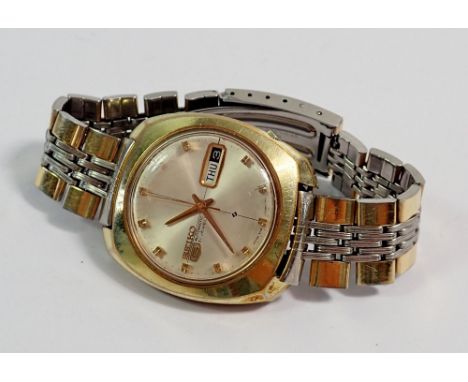 A gold plated cushion cased Seiko Five automatic wristwatch on bracelet 