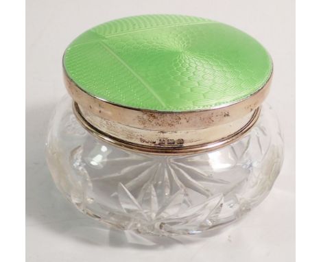 A cut glass powder bowl with silver and green enamel lid, 11cm diameter, Birmingham 1938 by Daniel Manufacturing Co. 
