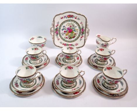 A Paragon Tree of Kashmir tea service comprising six cups and saucers, six side plates, cake plate and milk and sugar 
