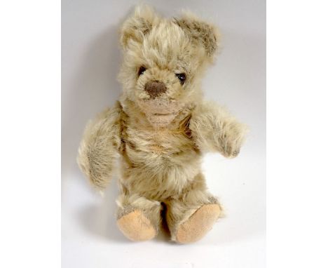 A 1950's Steiff Baby Zotty bear with button and repaired mouth, 16cm tall 