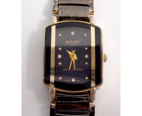 A Rado ladies wristwatch 22k gold style plate with black dial and diamond dot markers 