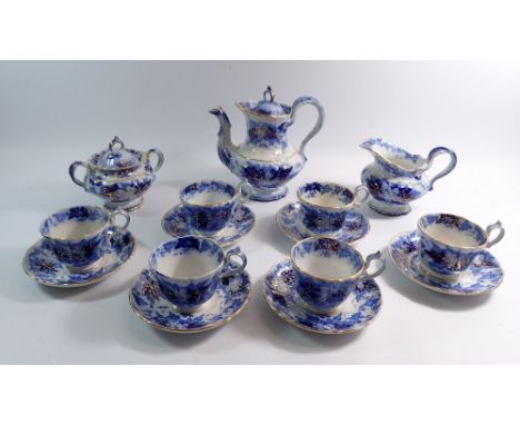 A Villeroy and Boch tea service comprising teapot, milk, sugar and six cups and saucers - with blue and white floral design a