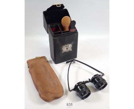 A Busch pair of 2.5 x 28cm binocular spectacles and a gents vanity case 