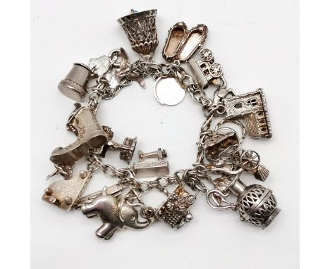 Silver charm bracelet with charms inc elephant, church with enamel detail wedding inside, penknife etc - 100g total weight