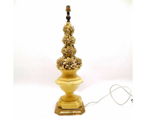 Large yellow pottery lamp base with encrusted leaf and flower detail on a giltwood base 67cm high - has some losses to the le