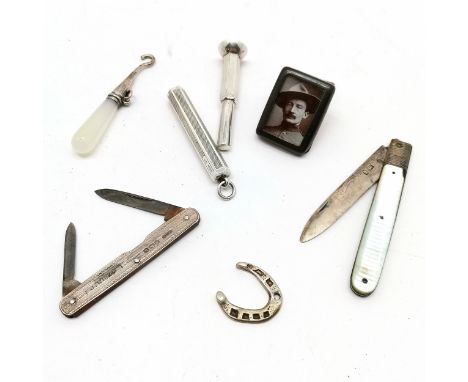 Qty of silver items inc cigar piercer, glove hook , penknife etc t/w Baden Powell in a metal frame - total weight (lot) 57g