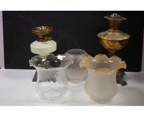 Two vintage oil lamps with glass shades 