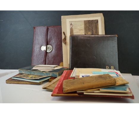 A tray of collectables to include two leather writing cases, assorted stationary and a vintage leather bound photograph album