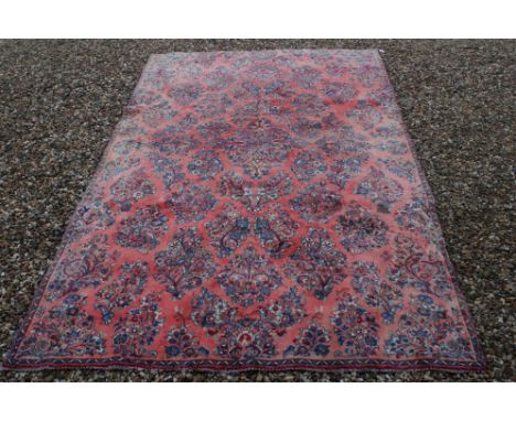 Vintage washed red ground Persian Kashan Rug, 285cms x177cms 