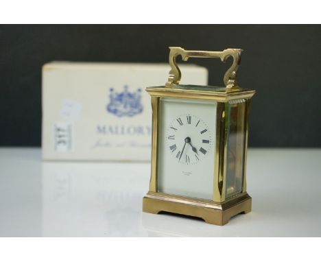 A vintage brass carriage clock from Mallory's of Bath complete with original retail box. 