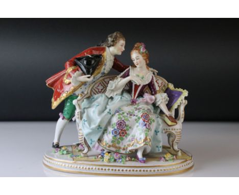 A Sitzendorf ceramic group of two young lovers in 18th century costume. 