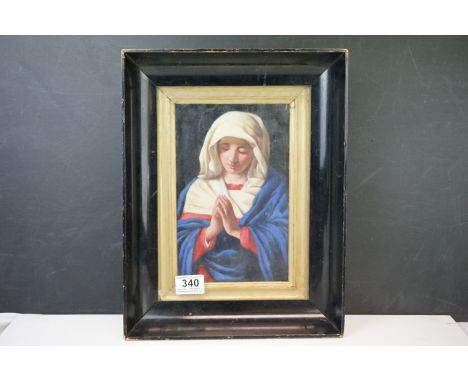 An ebonized framed Ecclesiastical oil painting portrait Madonna at her devotions 