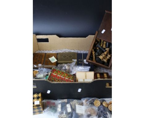 A collection of vintage games to include a boxed wooden chess set, 28 piece domino set, cribbage board, draughts set, cards a
