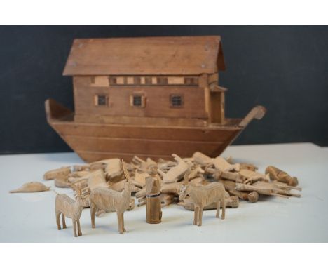 A vintage wooden scratch built model of Noah's Ark together with wooden carved animals. 