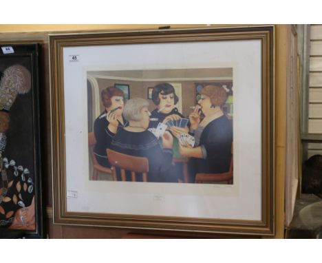 A framed and glazed limited edition print by Beryl Cook women playing cards signed in pencil. 