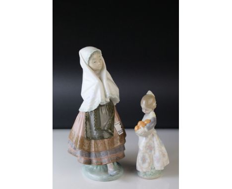 A Lladro figure of a girl with pleated dress and head scarf together with a figure of girl with oranges. 