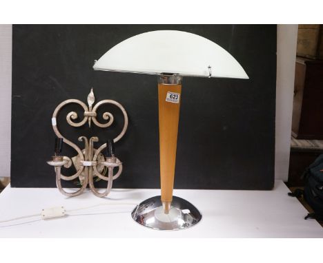 A metal twin branch Fleur De Lis wall light together with a modernist style mushroom lamp. 