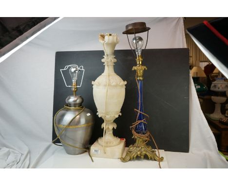 A Rococo style ormolu and blue glass lamp, a large carved alabaster lamp, and a metal double gourd shaped lamp.