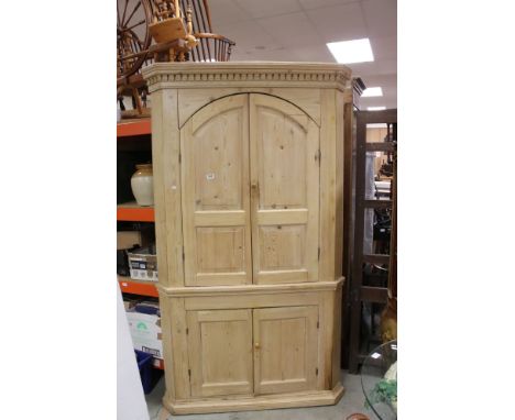 Large 19th century Pine Corner Cupboard, the upper section with two doors opening to reveal shaped shelves, above a lower sec