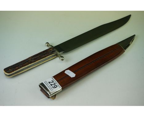 A vintage bowie knife by J.Rodgers with antler handle and leather scabbard, length is approx 37cm. 