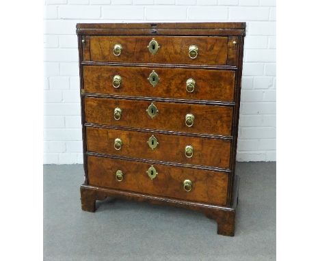 Diminutive 19th century walnut chest with a rectangular fold over top,  above pull out slides and  five long drawers with bra