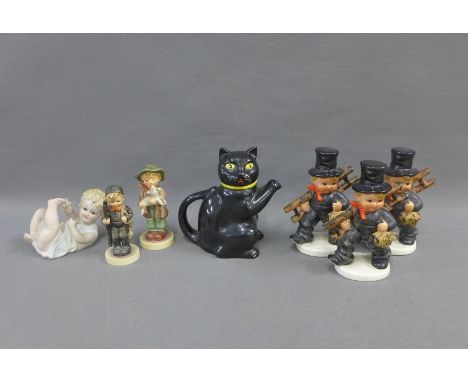Five Hummel figures, bisque pottery piano baby and a black cat teapot, (7) 
