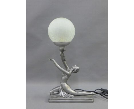 An Art Deco style figural table lamp base with a glass globe shade, 48cm high 